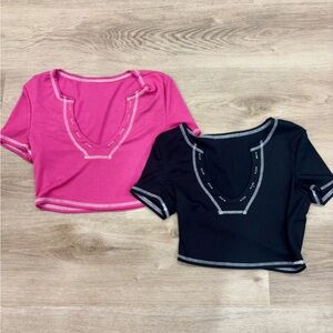 Pink and black cropped shirts